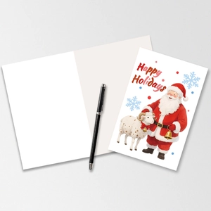 Close-up of Christmas card set featuring Santa illustration and handwritten holiday wishes