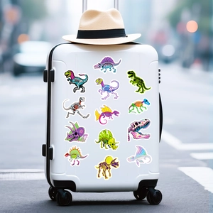 Autocollants de squelettes de dinosaures néon sur une valise blanche pour voyage