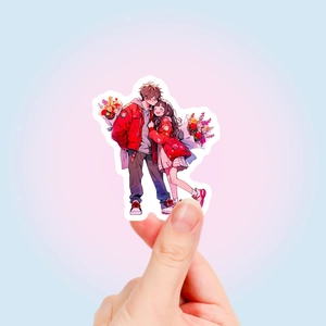 Close-up of a waterproof cartoon couple sticker with vibrant red details and glossy finish