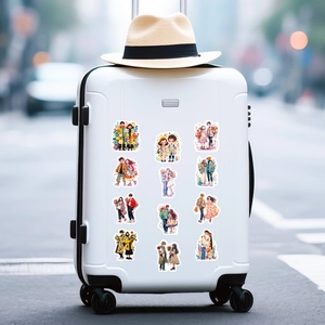 Cute couple doodle stickers displayed on a white suitcase for creative travel decoration