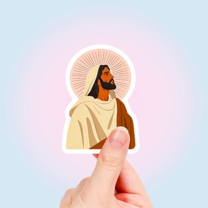 Macro-opname van een waterdichte Jezus-sticker met aureool voor decoratie van koffers