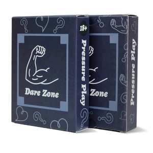 Detail of Dare Zone and Pressure Play 18+ adult party game boxes with matte finish