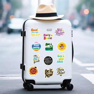 Waterproof motivational letter stickers with floral icons on a white suitcase