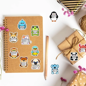 Detail of cute animal motivational stickers on a notebook with aesthetic lifestyle props