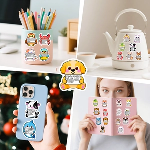 Waterproof cartoon animal stickers with motivational quotes on a laptop and water bottle