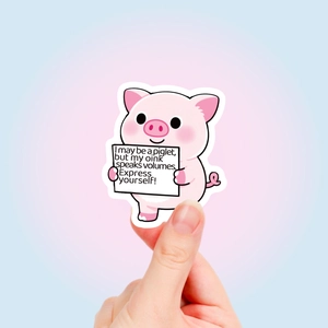 Hand holding a cute pink pig sticker with motivational quotes for school supplies decor