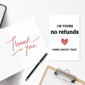 Flat lay of creative Valentine greeting cards with I'M YOURS text and red heart graphic