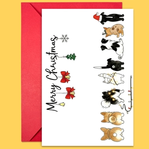 Gros plan d'une carte de Noël avec dessin d'animaux et enveloppe rouge festive