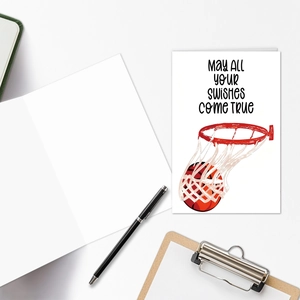 Detailed flat lay of basketball greeting card with envelope and stationery props