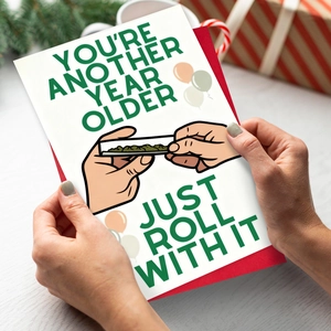 Funny Birthday card with roll-it puns, green envelope and festive gift background decor
