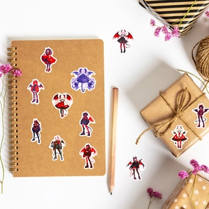 Detailed view of Lolita devil cartoon stickers on a kraft notebook and gift box