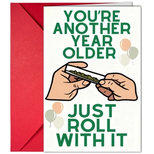 Detail view of birthday card with funny illustration and red envelope packaging
