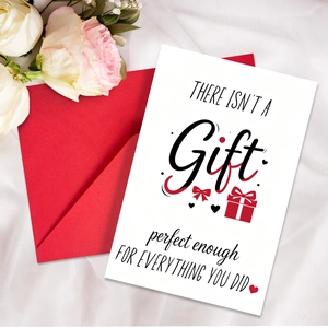 Detail of thank you greeting card with red envelope and white roses on silk fabric