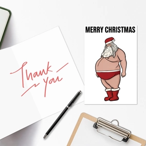 Flat lay of humorous Santa Christmas cards with red script Thank You design and envelopes