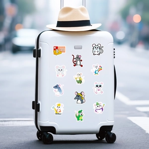 Detail of waterproof cartoon mouse stickers applied on a white travel suitcase