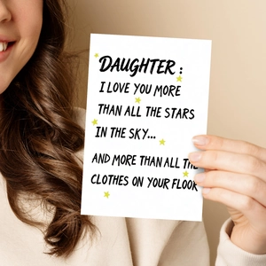 Detailed view of large white creative greeting card for daughters with humor text