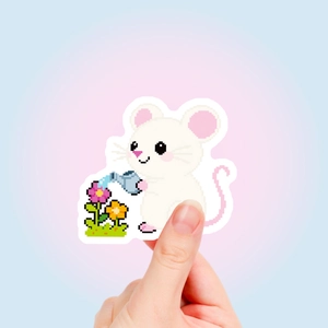 Detail of pixel art mouse sticker being held to show size and die-cut edge quality