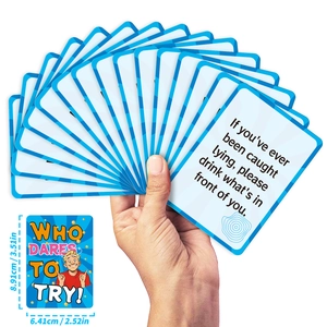 Close-up of 50 blue and white party game cards showing standard 3.5x2.5 inch dimensions