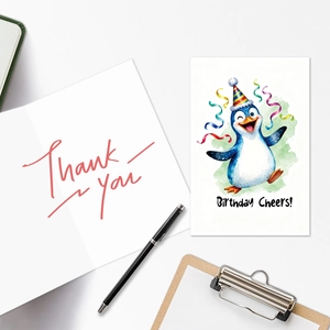 Detail of penguin birthday card featuring watercolor art and a Thank You message