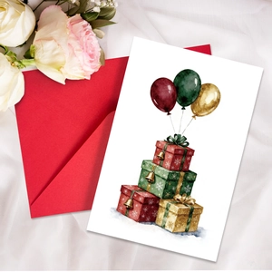 Detail of watercolor birthday card with gift boxes and balloons next to a red envelope