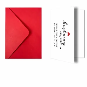 Detail view of red envelope and white greeting card with You Are Amazing message