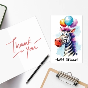 Detail of cartoon zebra birthday card and handwritten thank you note with office stationery