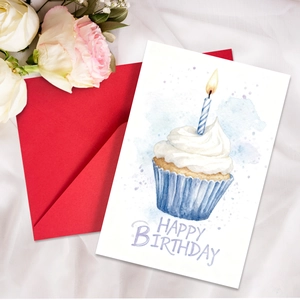 Watercolor birthday card with cupcake illustration and red envelope on white roses