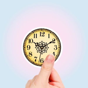 Close-up of a vintage round clock sticker featuring retro Arabic numerals and patterns