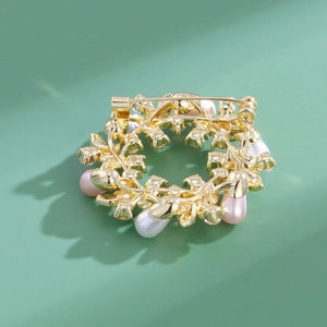 Elegant gold pearl wreath brooch with white rhinestones and secure safety pin closure