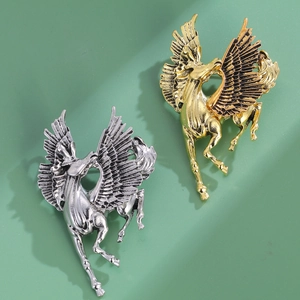Exaggerated vintage Pegasus metal brooches in gold and silver finish for bold accessory style