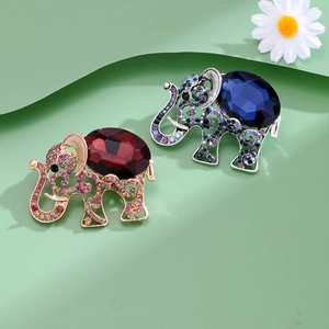 Vintage elephant brooches with rhinestones and oval gemstones in gold and silver finish