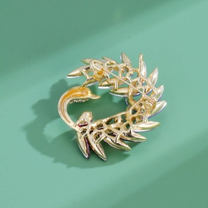 Elegant swan brooch with gradient crystals and golden metal base for stylish coats