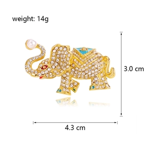 Elegant elephant brooch with sparkling crystals, blue enamel, and pearl accent detail