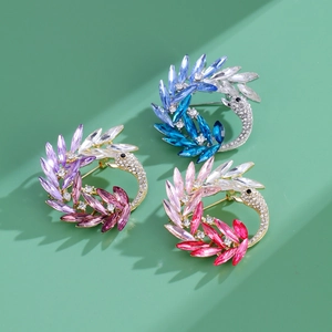 Elegant gold swan brooch set with colorful crystals and shimmering rhinestones
