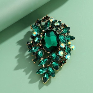 Vintage green crystal flower brooch with gold alloy and marquise cut rhinestones
