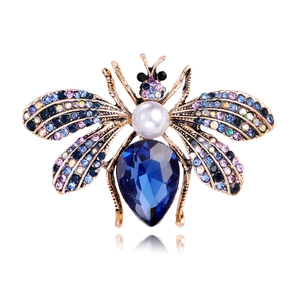 Vintage gold bee brooch with blue teardrop crystal, white pearl and colorful rhinestones
