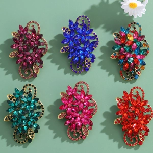 Vintage floral crystal brooches with colorful rhinestones in an elegant hollow design