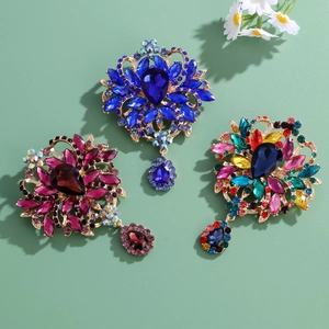 Vintage floral alloy brooches with teardrop rhinestones in blue, red, and multi-color