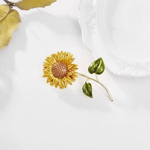 Elegant double-layered yellow sunflower brooch pin with green leaves and enamel finish