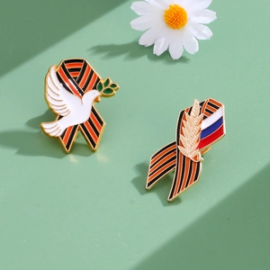 Detail of St. George ribbon enamel brooch with white dove and olive branch symbols