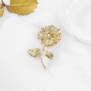 Detail view of the reverse side of the sunflower brooch with safety pin fastener