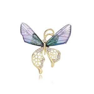 Élégante broche papillon avec ailes dégradées violettes et accents de strass dorés