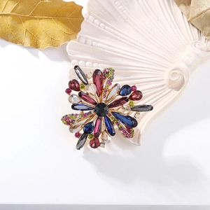 Detailed macro view of vintage colorful rhinestone floral brooch with elegant crystal inlay
