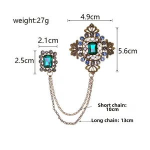 Broche baroque fleur émeraude avec chaînes dorées et perles pour vestes femme