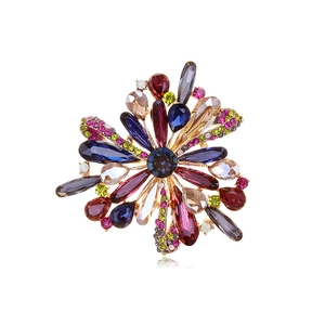 Elegant floral brooch with colorful rhinestones in a gold-plated setting for coats