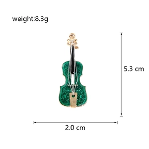 Detailed view of green violin brooch dimensions 5.3cm height and 8.3g weight