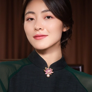 Elegant lotus flower brooch with pink enamel petals and pearl drops on a qipao collar