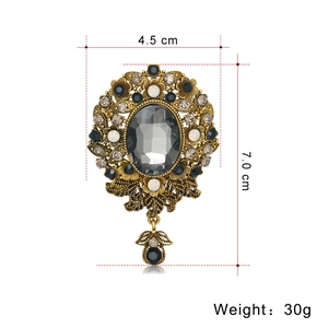 Vintage gold brooch with grey oval gemstone and crystal teardrop, 4.5cm by 7.0cm size