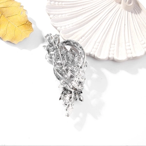 Detailed back view of a silver leaf brooch showing the secure pin fastener and metal hollows