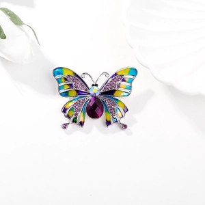 Vintage butterfly brooch with colorful enamel wings and purple teardrop crystal stones